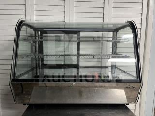 Yukon RTW-160 refrigerated display case with curved glass, two shelves, good condition, branded logo visible.