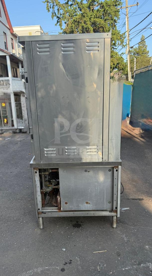 Market Forge ST-24M36G convection steamer, 24-pan capacity, freestanding, 36" boiler, 300,000 BTU, used condition.
