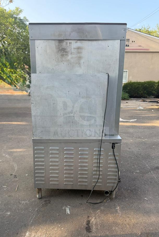 Market Forge ST-24M36G convection steamer, 24-pan capacity, freestanding, 300,000 Btu, rear view, used condition.