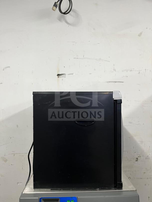 BRAND NEW Weston Pro-1200 12-tray Digital Dehydrator, 80L, black, side view. Model Pro-1200. Plug-in cord visible.