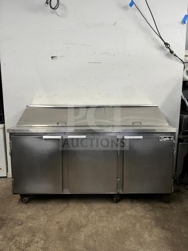 LEADER NSFM72 72" 3-door stainless steel refrigerated prep table for sandwiches and salads, good condition.