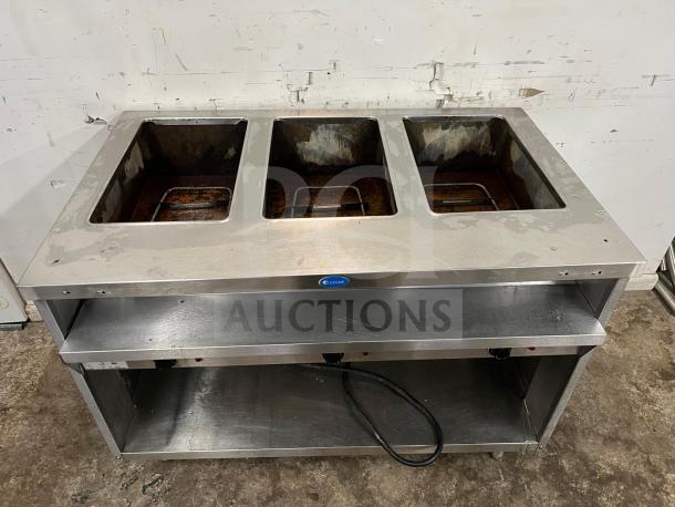 RANDELL 3513-120 48" electric hot food table with three top openings. Stainless steel, visible wear, power cord included.