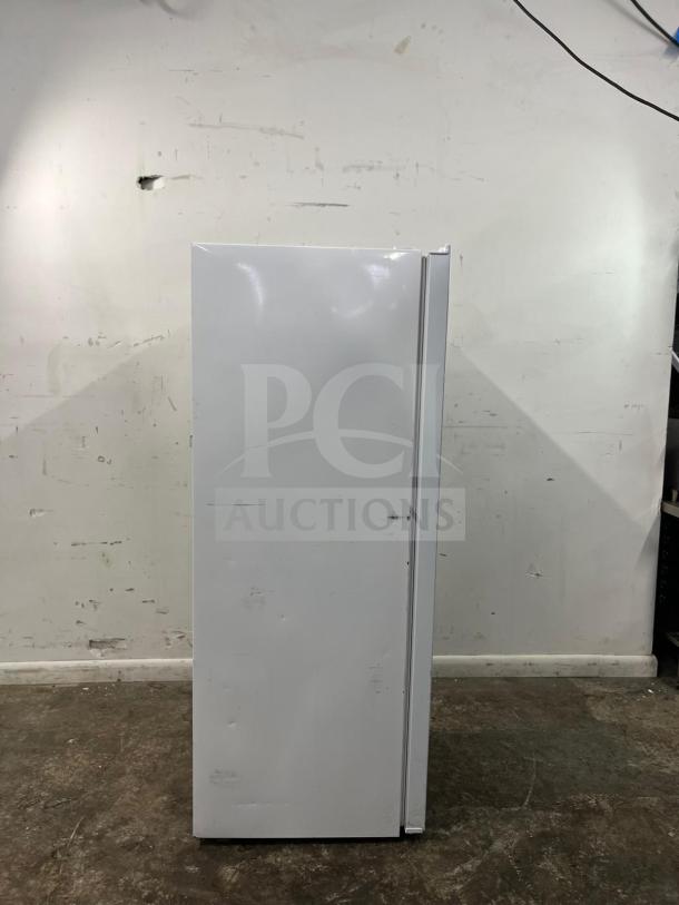 Insignia™ 7 Cu. Ft. Upright Convertible Freezer, model NS-UZ70WH4, white, small dents, versatile freezer or fridge.