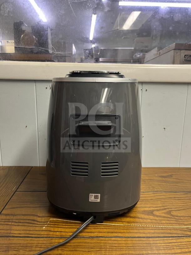 Ninja AF161 Air Fryer Max XL, sleek design, rear view, power cord visible, good condition, model label at base.
