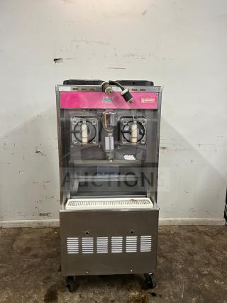 TAYLOR 342D Double Flavor Frozen Drink Machine, stainless steel, visible Dunkin' Donuts branding, on wheels, used condition.