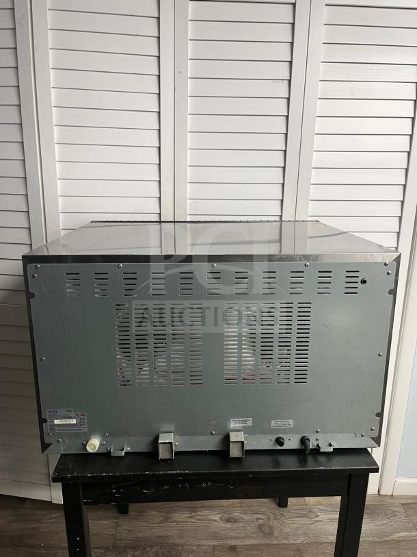 Avantco CO-38M Convection Oven, 4.4 cu. ft., 208/240V, 3,500/4,600W. Rear view showing vents and controls.