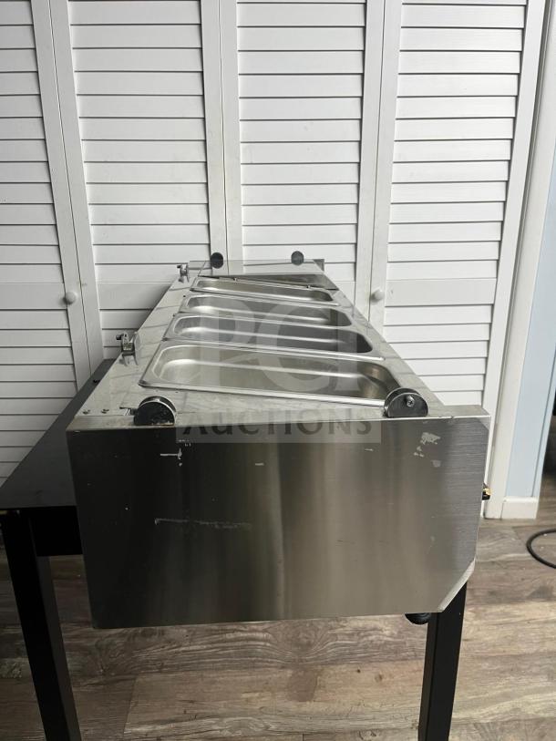 Coldline CTP60SS 60" refrigerated countertop salad bar, stainless steel, holds 6 pans, visible wear on exterior.