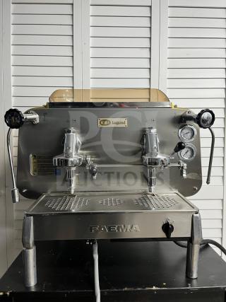 FAEMA E61 Legend semi-automatic espresso machine in excellent condition. Features dual group heads, pressure gauges, and chrome finish.