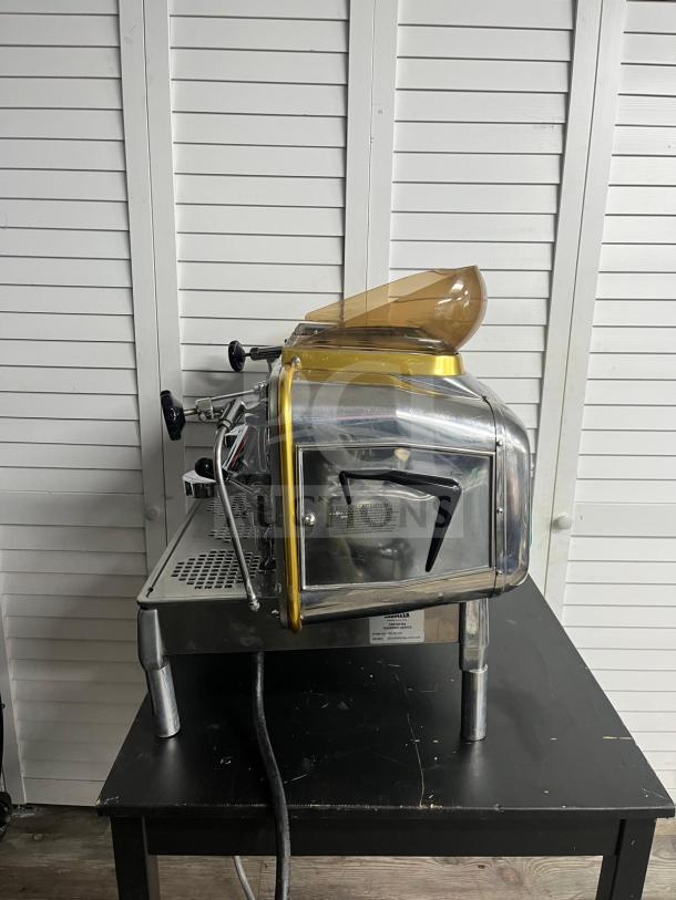 FAEMA E61 Legend S/2 semi-automatic espresso machine, 28-inch, in excellent condition, gold accents, clear hopper.