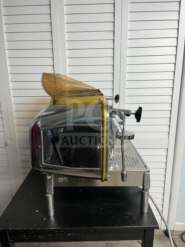 FAEMA E61 Legend S/2 espresso machine, semi-automatic, excellent condition, 28 inches, metallic finish, side view.