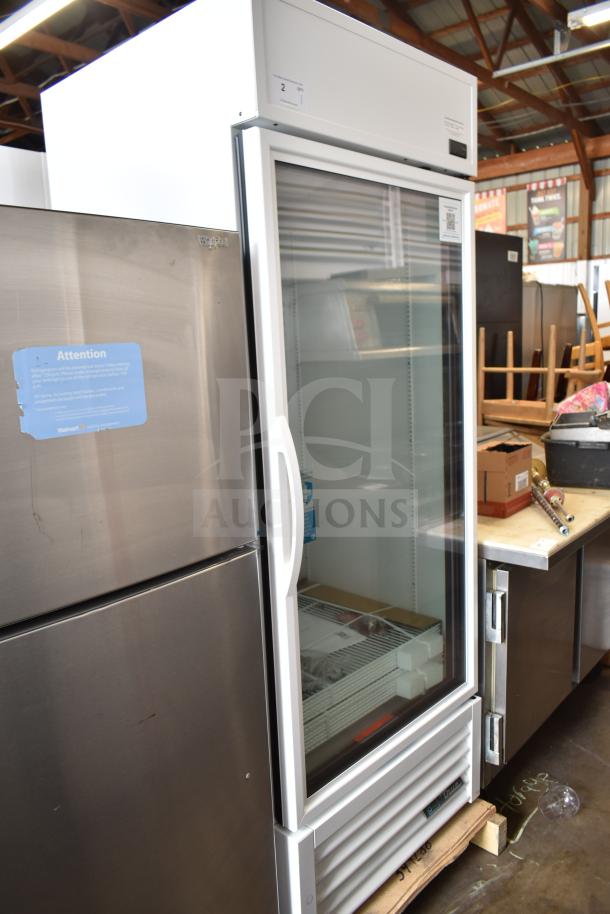 Brand new True TSCI-600R-G-PH single door cooler, model TVM-48SL-HC, 115 volts, with visible scratch and dent.