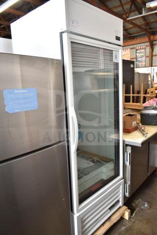 Brand new True TSCI-600R-G-PH single door cooler, model TVM-48SL-HC, 115 volts, with visible scratch and dent.