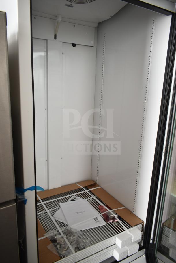 Brand new 2026 True TSCI-600R-G-PH commercial cooler, single door, model TVM-48SL-HC, 115V, 1 Phase, interior view with materials.