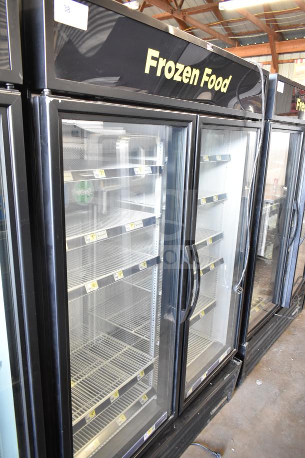 2021 True GDM-49F-HC commercial 2-door freezer merchandiser, glass doors, "Frozen Food" signage, excellent condition.