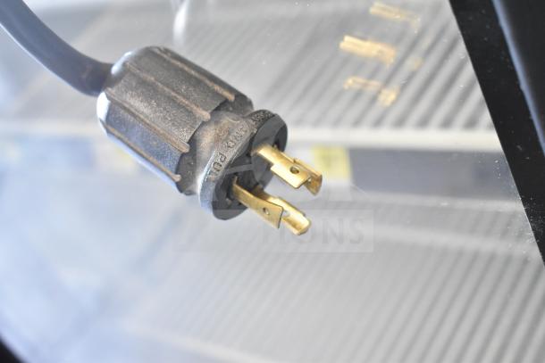 Plug of 2021 True GDM-49F-HC commercial freezer, showing a three-prong connection.