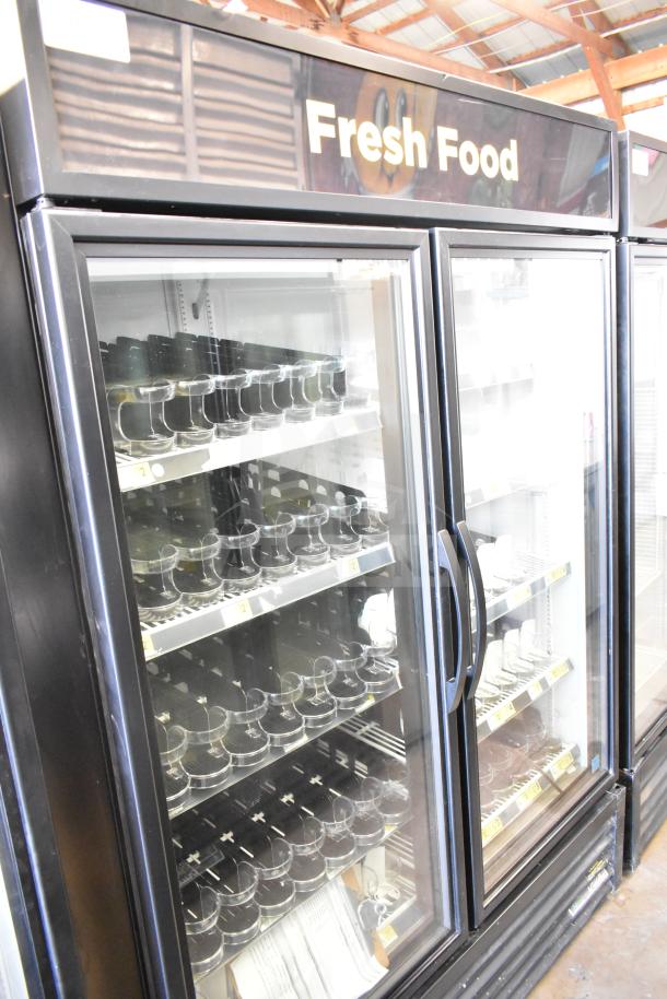 2021 True GDM-49-HC commercial 2-door reach-in cooler merchandiser with glass doors, labeled "Fresh Food," in excellent condition.