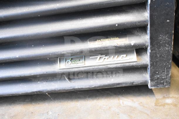 True GDM-49-HC cooler base with logo and "natural refrigerants" label, showing vent grill details.
