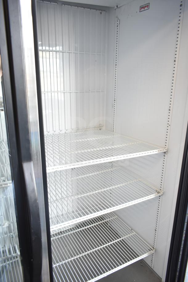 True GDM-49F-HC 2-door commercial freezer, 2019 model, white interior, multiple shelves, clean condition, 115/208-230 volts.