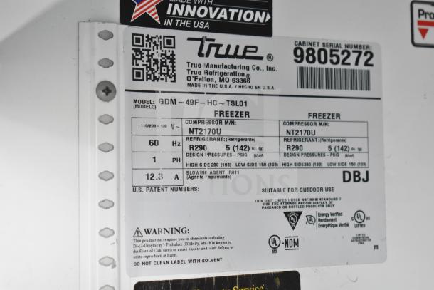 2019 True GDM-49F-HC commercial freezer, 2-door, 115/208-230V, 1 Phase. Label shows model, voltage, and refrigerant details.