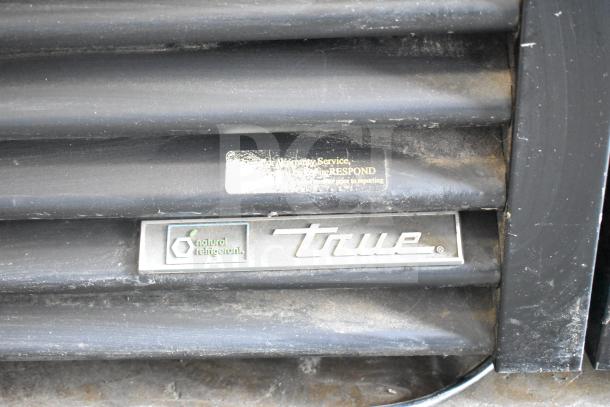 2021 True GDM-49-HC cooler grille, "natural refrigerant" marked, shows used condition, indicative of commercial use.