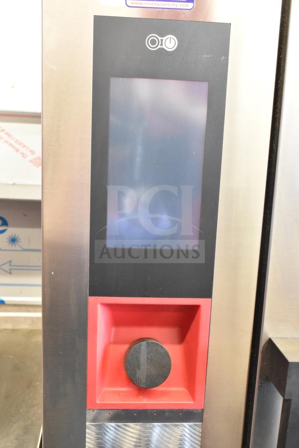 Bakers Pride AETG101R stainless steel combi convection oven control panel, featuring touch screen and knob, on equipment stand.