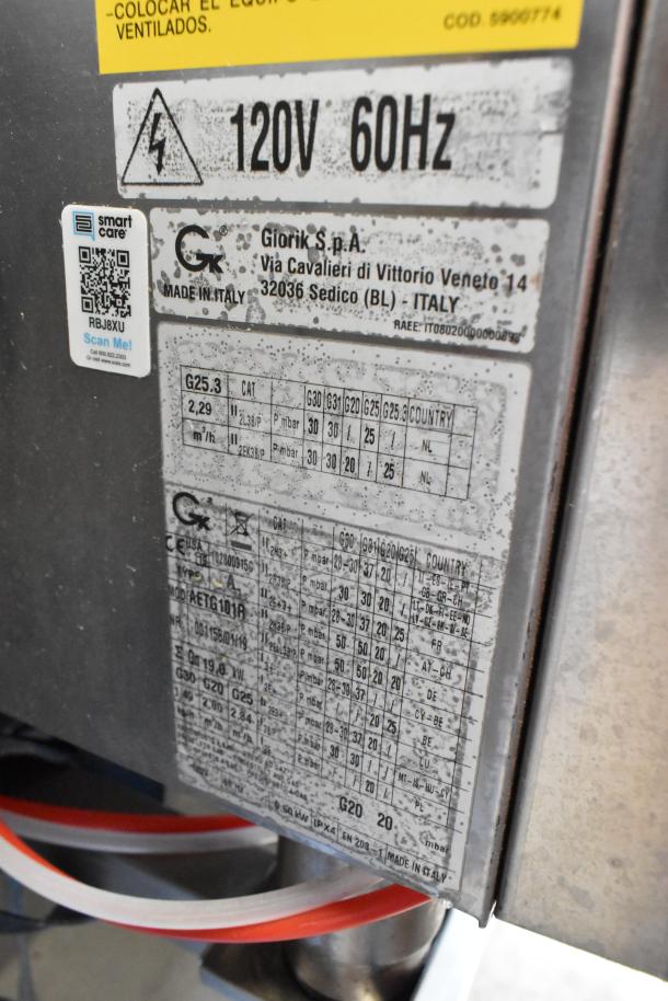 Bakers Pride AETG101R stainless steel combi convection oven, natural gas-powered, on stand, with equipment labels visible.