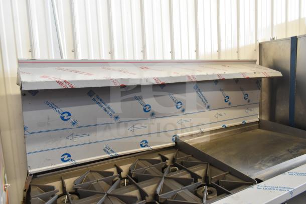 BRAND NEW SCRATCH AND DENT Vulcan 72" gas range, model 72SS-6B36GTN, with 6 burners, 36" griddle, 2 ovens, protective wrapping visible.