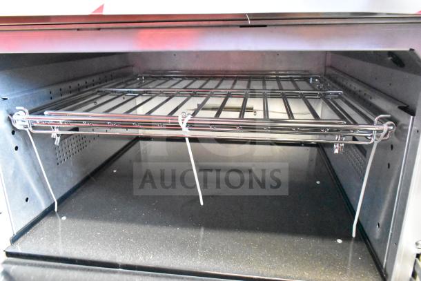 BRAND NEW Vulcan 72SS-6B36GTN range interior, showing oven rack and pristine condition.