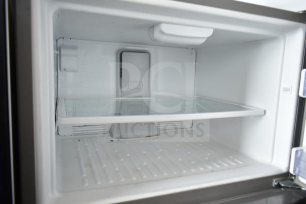 2018 Whirlpool WRT511SZDM00 reach-in cooler with freezer, 115 volts, 1 phase; interior view, clean condition.