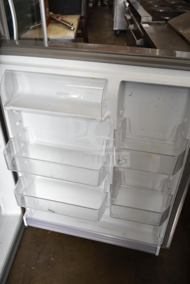 2018 Whirlpool WRT511SZDM00 cooler with freezer, 115 volts, 1 phase, interior shelves shown, used condition.