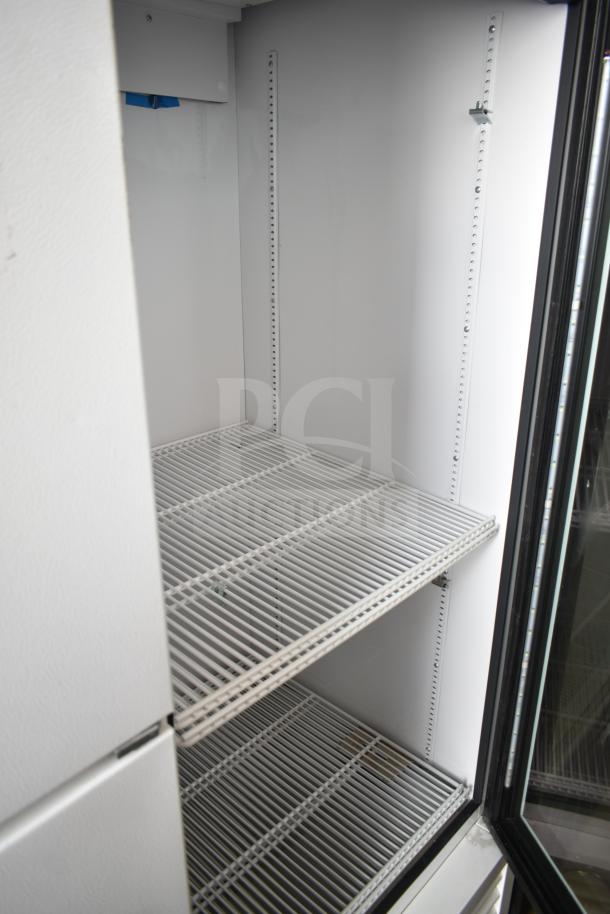 2021 True TSCI-600R-G-PH commercial single door cooler, 115V, white interior, adjustable shelves, clean condition.