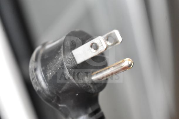 Close-up of the power plug for the 2021 True TSCI-600R-G-PH commercial cooler, 115 volts, 1 phase.