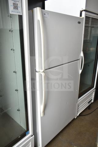Whirlpool W1TXNMFWQ00 reach-in cooler with freezer, white finish, two doors, visible sign of wear. Model W1TXNMFWQ00.