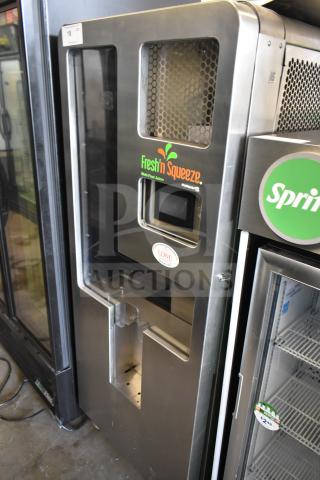 LATE MODEL JBT 2ND-GEN-MFJ-HE Fresh N Squeeze citrus juicer on casters, 115V, 1-phase, commercial use, stainless steel.