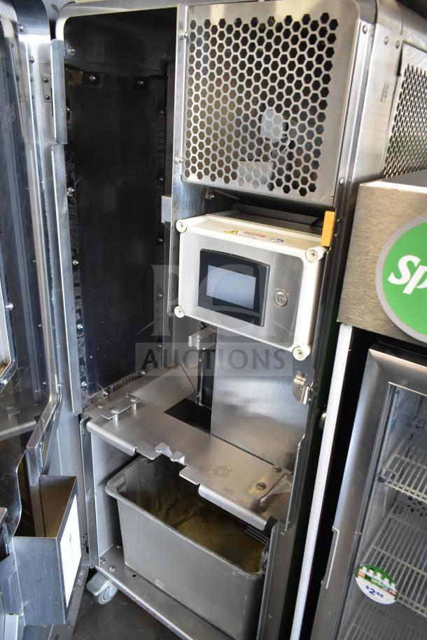 JBT 2ND-GEN-MFJ-HE commercial citrus juicer in stainless steel, features touchscreen, on casters, for 115V, 1 phase.