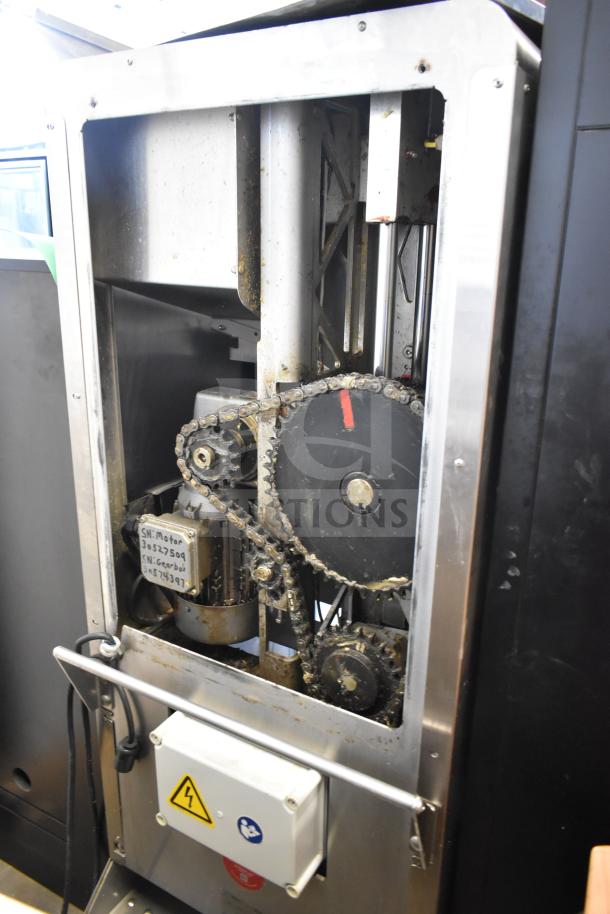 LATE MODEL! JBT 2ND-GEN-MFJ-HE commercial citrus juicer, visible gears and motor, slightly worn, on casters, 115V, 1 Phase.