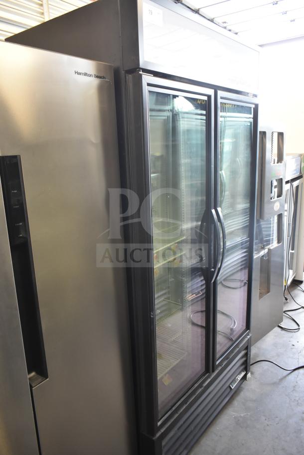 2021 True GDM-35F-HC 2 Door Reach In Cooler Merchandiser, 115 Volts, 1 Phase; glass doors, shelves visible.
