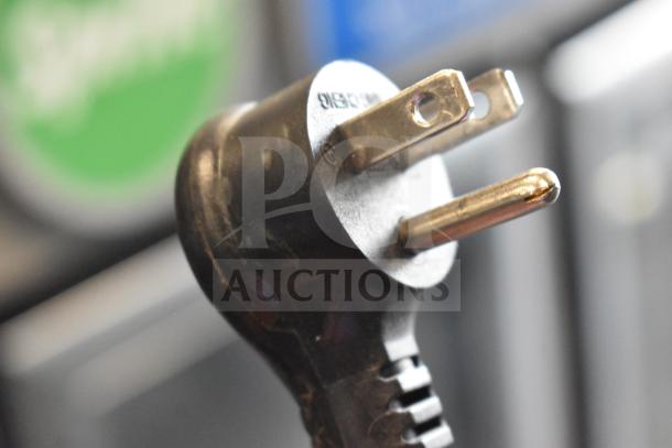 Close-up of the plug for a 2021 True GDM-35F-HC 2 Door Reach In Cooler Merchandiser, 115 volts, 1 phase.