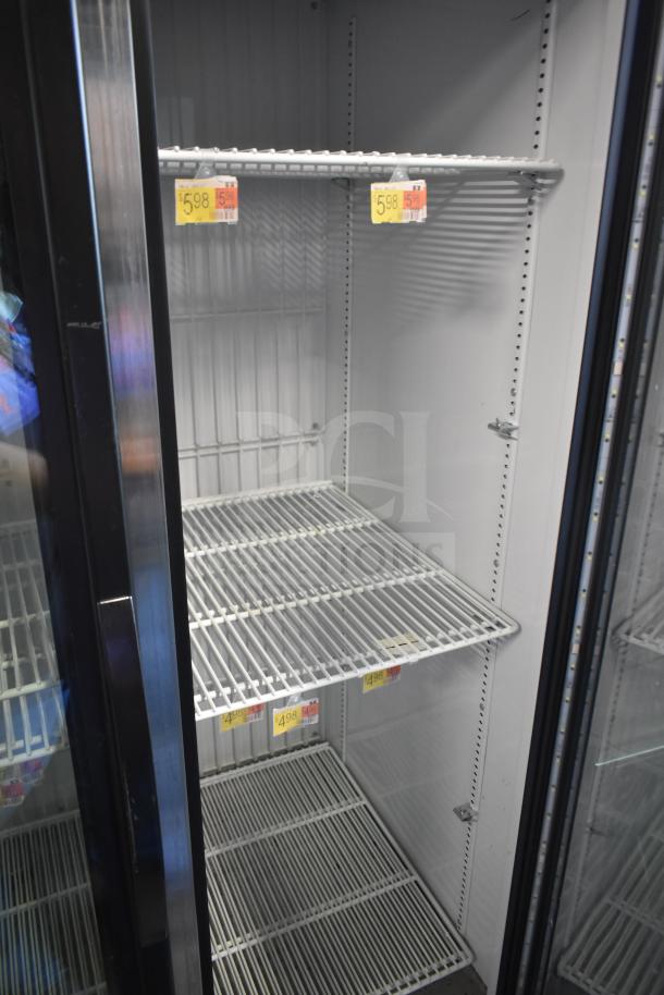 2021 True GDM-35F-HC reach-in cooler merchandiser; 2 glass doors, shelves inside, model info on left. Good condition.