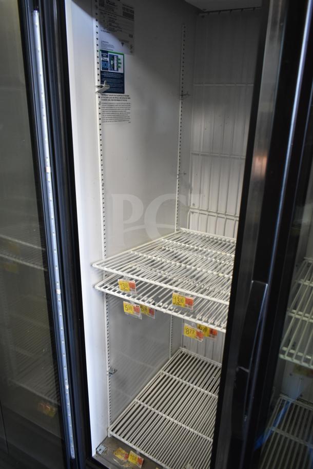 2021 True GDM-35F-HC commercial 2-door reach-in cooler, 115 volts, clean, shelves intact, interior label with specs visible.