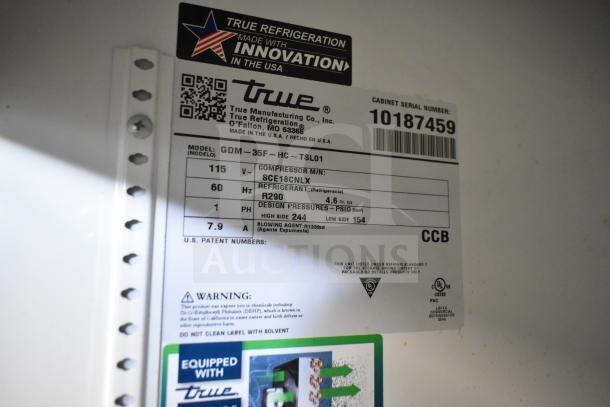 2021 True GDM-35F-HC commercial cooler label, 115V, 1 phase, R290 refrigerant, model info, warning details visible.