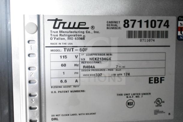 2016 True TWT-60F 2 Door Work Top Freezer, commercial casters, 115V, 1 Phase, label: model, compressor, refrigerant info.