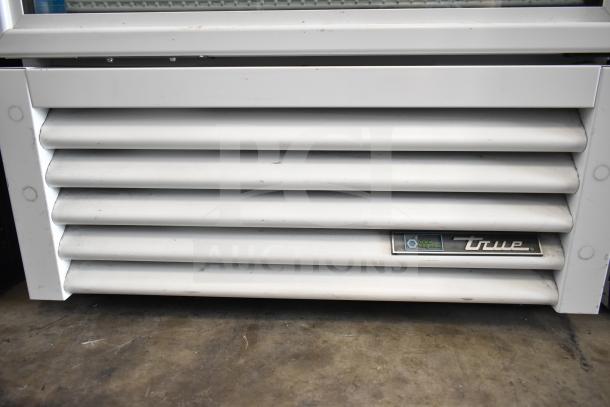 2021 True TSCI-600R-G-PH commercial cooler, single door, 115V, 1 phase. Visible True logo, natural refrigeration label.