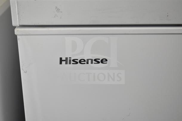 Hisense WFC070MSRWD chest freezer, white finish, 115 volts, 1 phase. Visible logo. Condition shows minor wear.