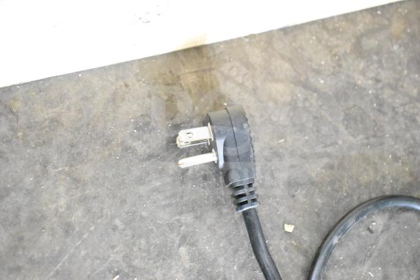 Power cord of Hisense WFC070MSRWD Chest Freezer, showing a three-prong plug, compatible with 115 Volts, 1 Phase.