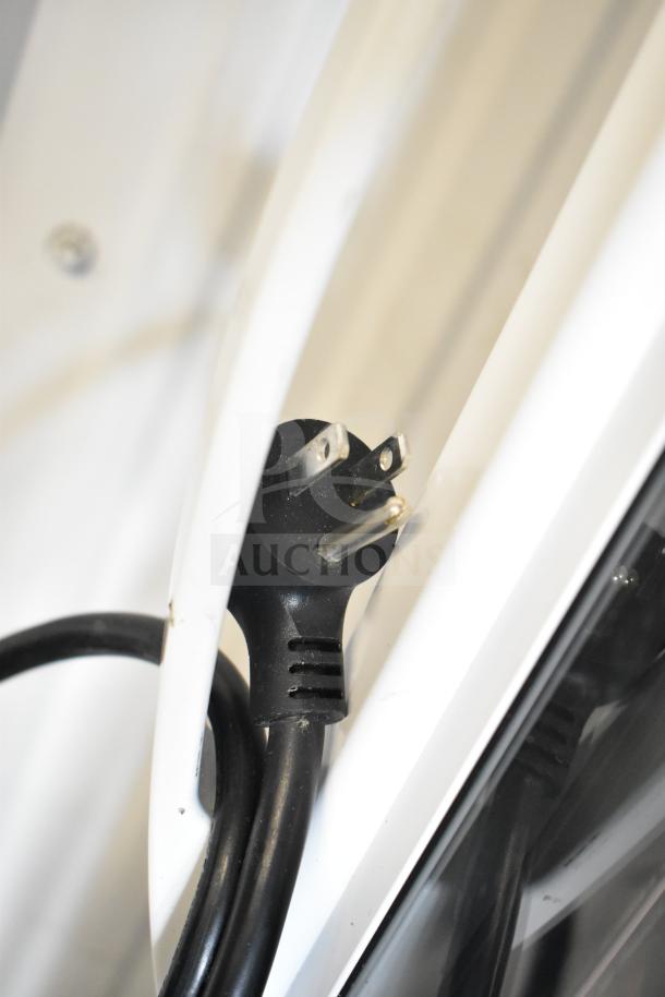 Close-up of the plug and cord of a 2021 True TSCI-600R-G-PH Commercial Reach In Cooler Merchandiser, 115V, 1 Phase.