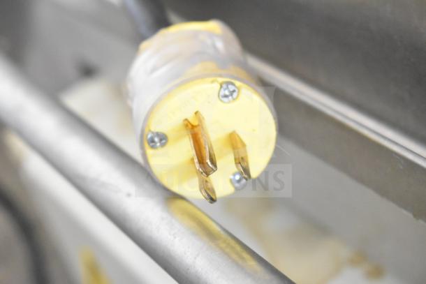 Close-up view of a commercial-grade power plug for the JBT 2ND-GEN-MFJ-HE Citrus Juicer, showing sturdy construction.