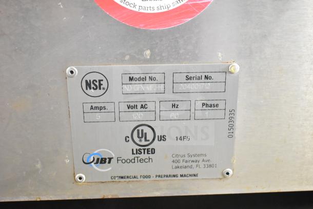 NSF-certified JBT 2ND-GEN-MFJ-HE citrus juicer label, 115V, 5 Amps, 60Hz, UL listed, serial 20400712, on commercial casters.