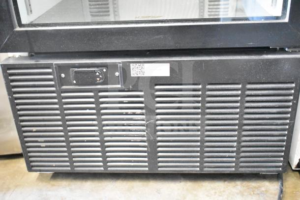 2019 Habco SE18 commercial single door reach-in cooler merchandiser, 115 volts, 1 phase, black exterior, visible wear.