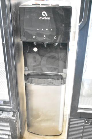 Avalon A4BLWTRCLR water cooler, 115 volts, black and silver finish, with three dispensers, branded on top panel.